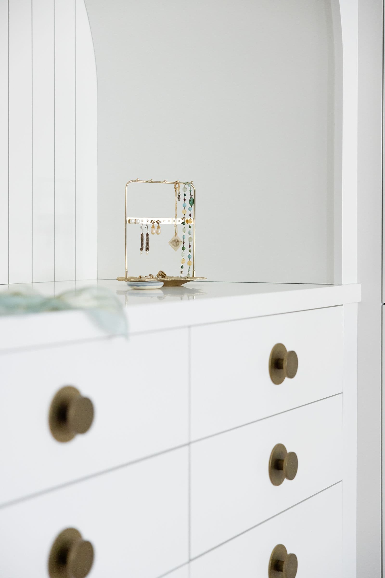 Fitted drawers with brass pulls, the Blue Mudroom